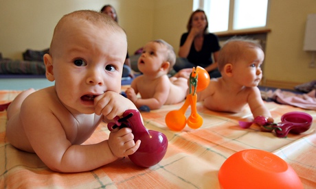 Babies playing in a nursery