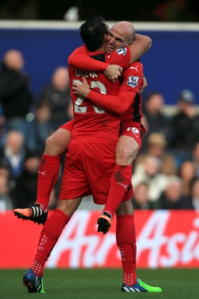 Leicester City's Esteban Cambiasso celebrates his goal with with Leonardo Ulloa