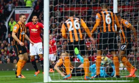 McGregor clumsily attempts to grab the greasy ball but can't stop it squirming over the line. United take the lead.