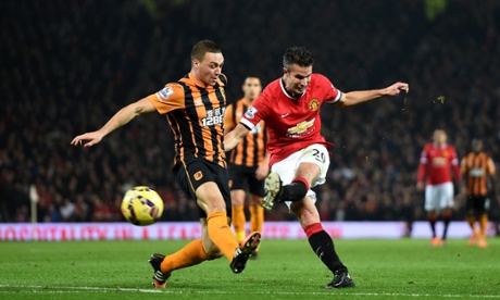 Manchester United's Robin Van Persie scores his sides third goal under pressure from Hull City's James Chester.