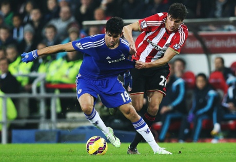 Santiago Vergini clings to Diego Costa.