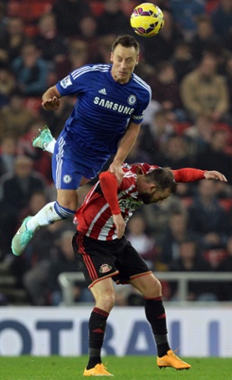 John Terry climbs highest over Steven Fletcher.