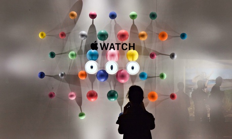 A woman stands before a window display