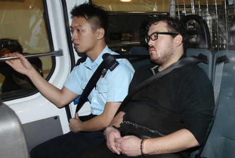 Rurik Jutting in a police van as it arrives at a court in Hong Kong