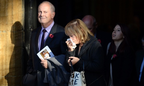 Gyles Brandreth and his wife Michele Brown after the funeral at St Bartholomew's church.