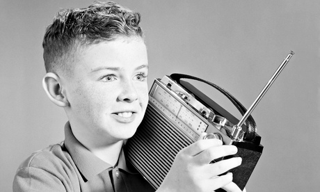 Boy listening to portable radio