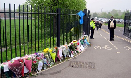 Flowers left in tribute to Anne Maguire outside Corpus Christi Catholic college in Leeds
