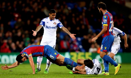 Mile Jedinak sees red for kicking back at Jordi Gomez.