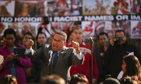 Minnesota congressman Keith Ellison leads the crowd in a chant of ‘Change the Name’ during a rally before the Vikings faced the Washington team on Sunday.