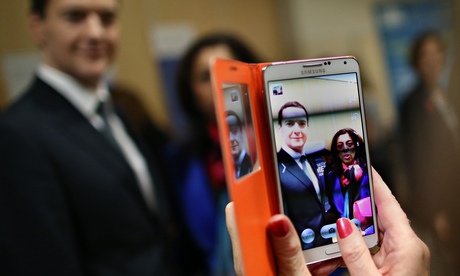 George Osborne poses for a photo with a member of the public in Beeston