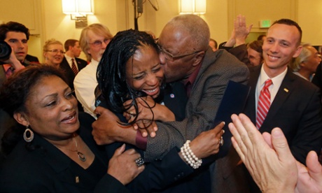 Mia Love celebrates with her father, Jean Maxime Bourdeau, after winning the election for Utah's 4th congressional district in Salt Lake City. Love becomes first black female Republican elected to Congress.