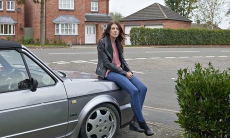 Mel Hurd in her front garden with her VW Golf