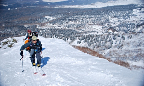 men on skis on a snowy mountain