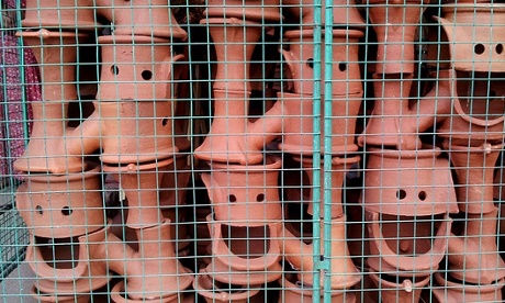 Shop displays that raise a smile. Roadside pottery in Sri Lanka stacked quite accidentally making these smiley faces.