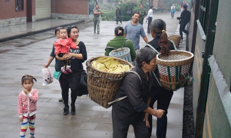 Passengers wait to board the train, which takes 75 minutes to travel about 12 miles.