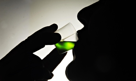 An addict takes his prescription of methadone