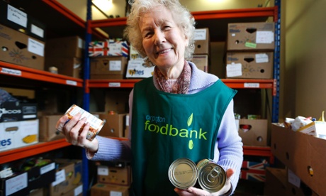 Food bank volunteer Diana Grant sorts cans of food at a food bank in Bromley, south London.
