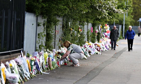Floral tributes to Ann Maguire outisde the school 
