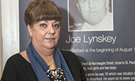 Maria Lynskey in front of a photo of her uncle, Joe 