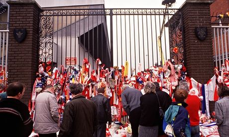 People lay tributes to the 96 killed at Hillsborough outside Liverpool's Anfield stadium in 1989