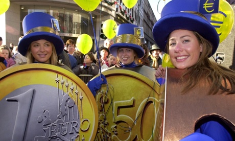 Dubliners celebrate the adoption of the euro in Ireland on 1 January 2002.