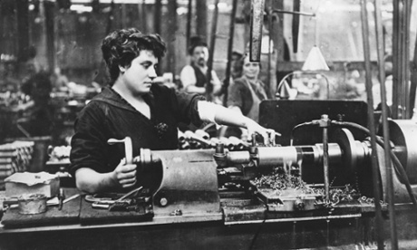 A female worker operating a machine in an armaments factory in 1915