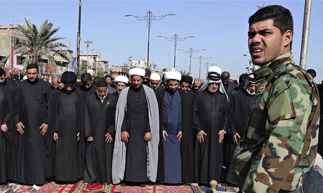 An army guard at Friday prayers in Baghdad