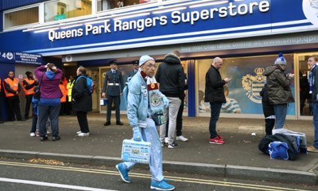 Manchester City Man walks past Loftus Road this afternoon.