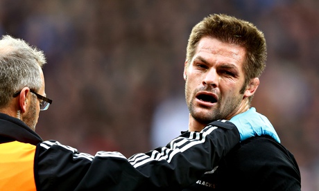 Richie McCaw of New Zealand receives attention during the match against England at Twickenham