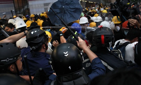 Police use pepper spray against the protesters near the government headquarters in the Admiralty district.