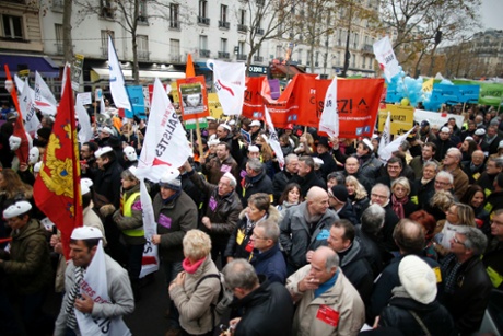 Heads of small and mid-size French companies hold banners as they attend a demonstration organized by the French CGPME (Confederation of Small and Medium Sized Enterprises) employers groups to protest against government policy and what they see as excessive restrictions and charges in Paris December 1, 2014.