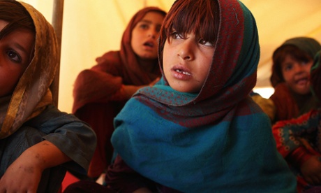 A class held in a tent at the Norwegian Refugee Council funded school at Gulan refugee camp.