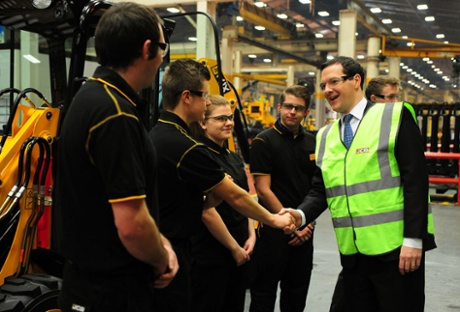 George Osborne meets apprentices during a visit to JCB's backhoe loader factory in Staffordshire.