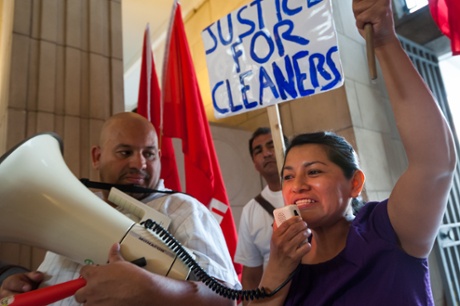 A campaigner demands better conditions for low-paid workers at University of London. EMployment is up but many of the jobs being created are low-paid.