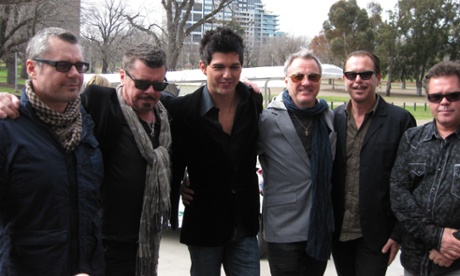 Members of INXS (from L-R) Jon Farris, Tim Farris, JD Fortune, Garry Beers, Kirk Pengilly, Andrew Farris pose outside the MCG Thursday, Sept. 23, 2010