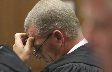 State prosecutor Gerrie Nel listens in court as judge Thokozile Masipa delivers her finding.