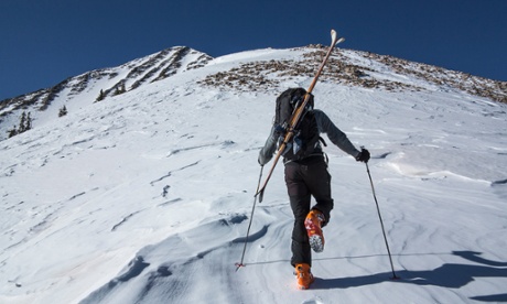 Moab, Utah, USA --- Cross country skier hiking up slope --- Image by   Whit Richardson/Image Source/Corbis30s 