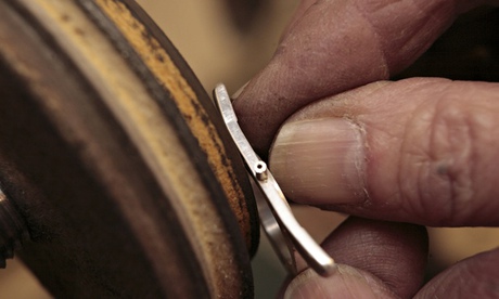 A silversmith works on watch part in Wilshire