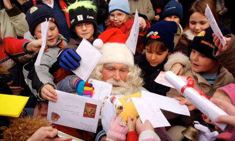 A Santa Claus impersonator is surrounded by children at the Christmas Post Office in Himmelpfort, in northern Germany.