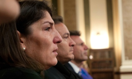 Parents of Diren Dede – mother Gulcin, left, and father Celal Dede, center, listen to opening statements at Missoula County Courthouse.