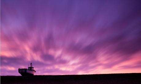 Lone fishing boat at sea.