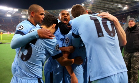 Samir Nasri of Manchester City is swamped.