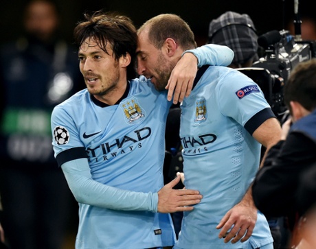 Manchester City's Spanish midfielder David Silva congratulates City's Argentinian defender Pablo Zabaleta after he made it 2-0.