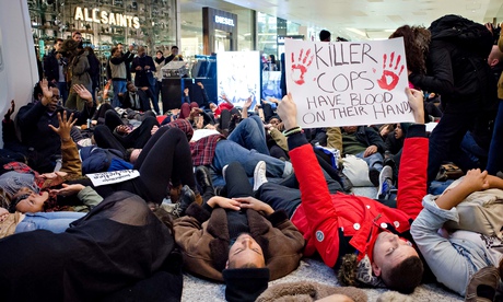 Hundreds of protesters have staged a “die-in” at the Westfield shopping centre in west London