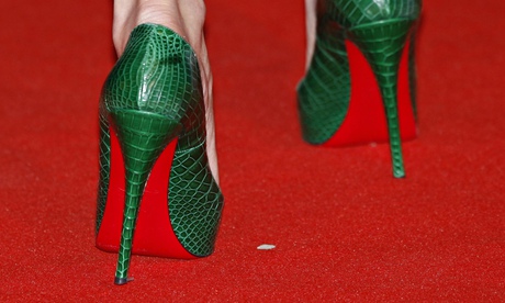 British actor Rosamund Pike arrives at the Bafta awards ceremony in high heels