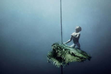A Moken man on an artificial reef he has created to attract fish.