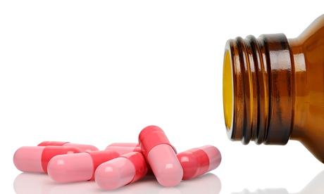 Prescription drugs poured from their bottle.