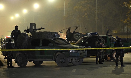 Afghan soldiers near the site where a bomber blew himself at the Istiqlal high school in Kabul