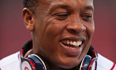 A head for business: Dr Dre wears his signature Beats headphones.