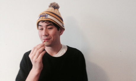 Dean Kissick eating cheese in a hat